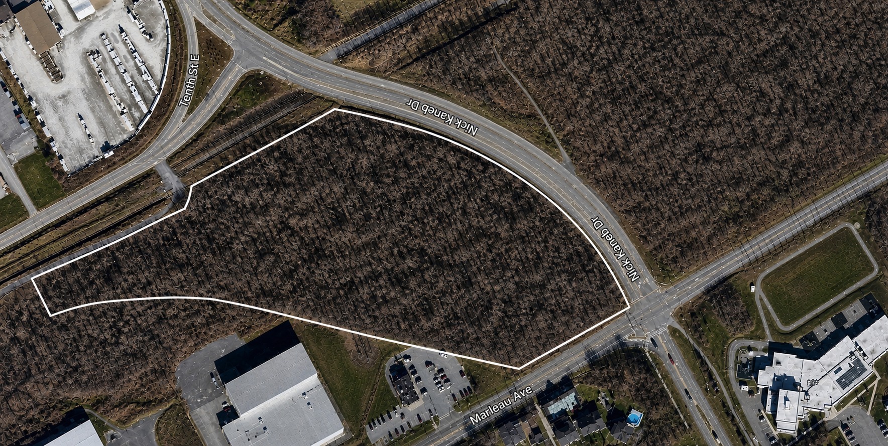 Aerial view of the 10-acre commercial parcel with property boundary outlined, Cornwall ON